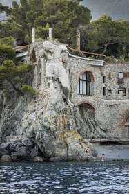 Italy, Liguria, Cinque Terre National Park listed as World Heritage by UNESCO, village of Monterosso al Mare, concrete statue of the giant near the beach of Fegina which represents the god of the sea Neptune