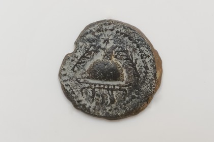Israel, Jerusalem, Davidson Center, bronze coin of king Herod the Great dated to 37 BCE representing a helmet flanked by two palm branches