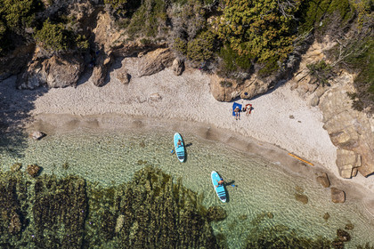 France, Var, Six Fours les Plages, Ile des Embiez, Coucoussa beach, Freestyle windsurfing champion Adrien Bosson on a paddle boarding excursion (aerial view)