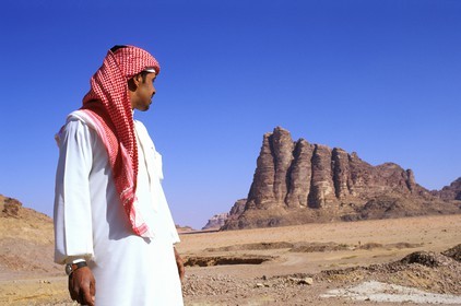 Jordan, Wadi Rum, Bedouin in front of the seven pillars of wisdom