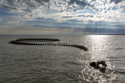 France, Loire Atlantique, Saint-Brevin-les-Pins, Mindin, Estuaire (Estuary) open-air contemporary art collection, the Ocean Serpent created by the Chinese artist Huang Yong Ping representing a long skeleton of a sea serpent, installed on the 'foreshore and appearing to the rhythm of the tides  (aerial view)