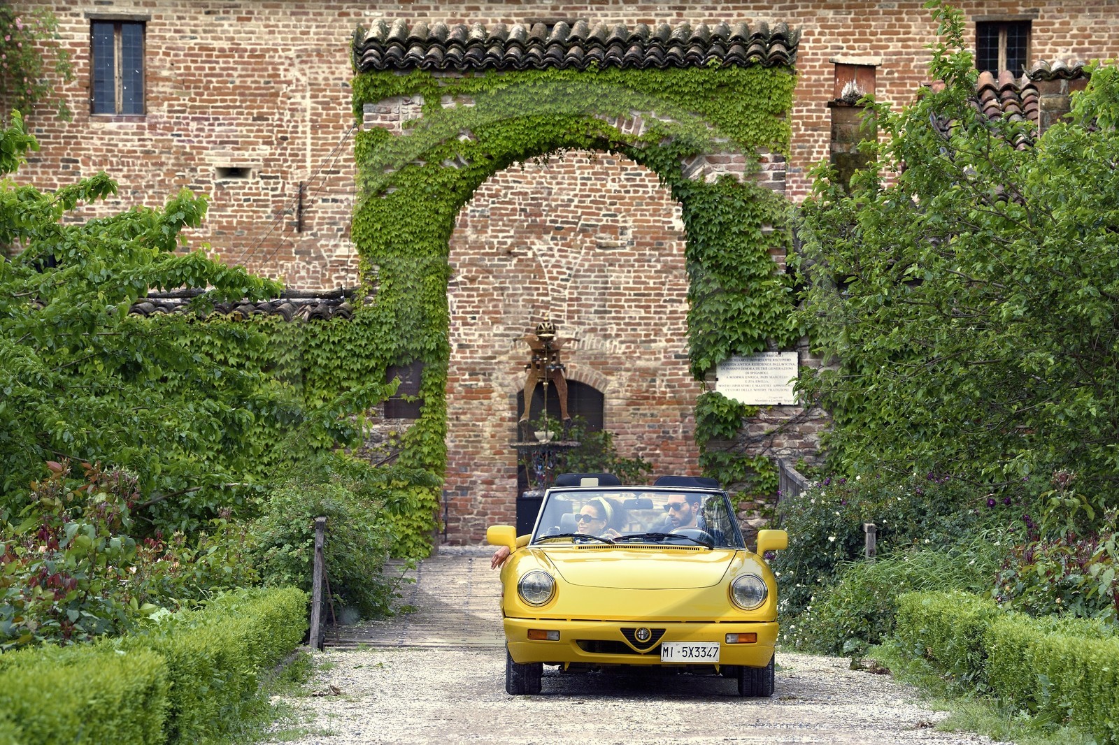 Italy, Emilia Romagna, Polesine Zibello near Parma, Antica Corte Pallavicina Hotel and restaurant, Alfa Romeo Duetto Spider yellow cabriolet