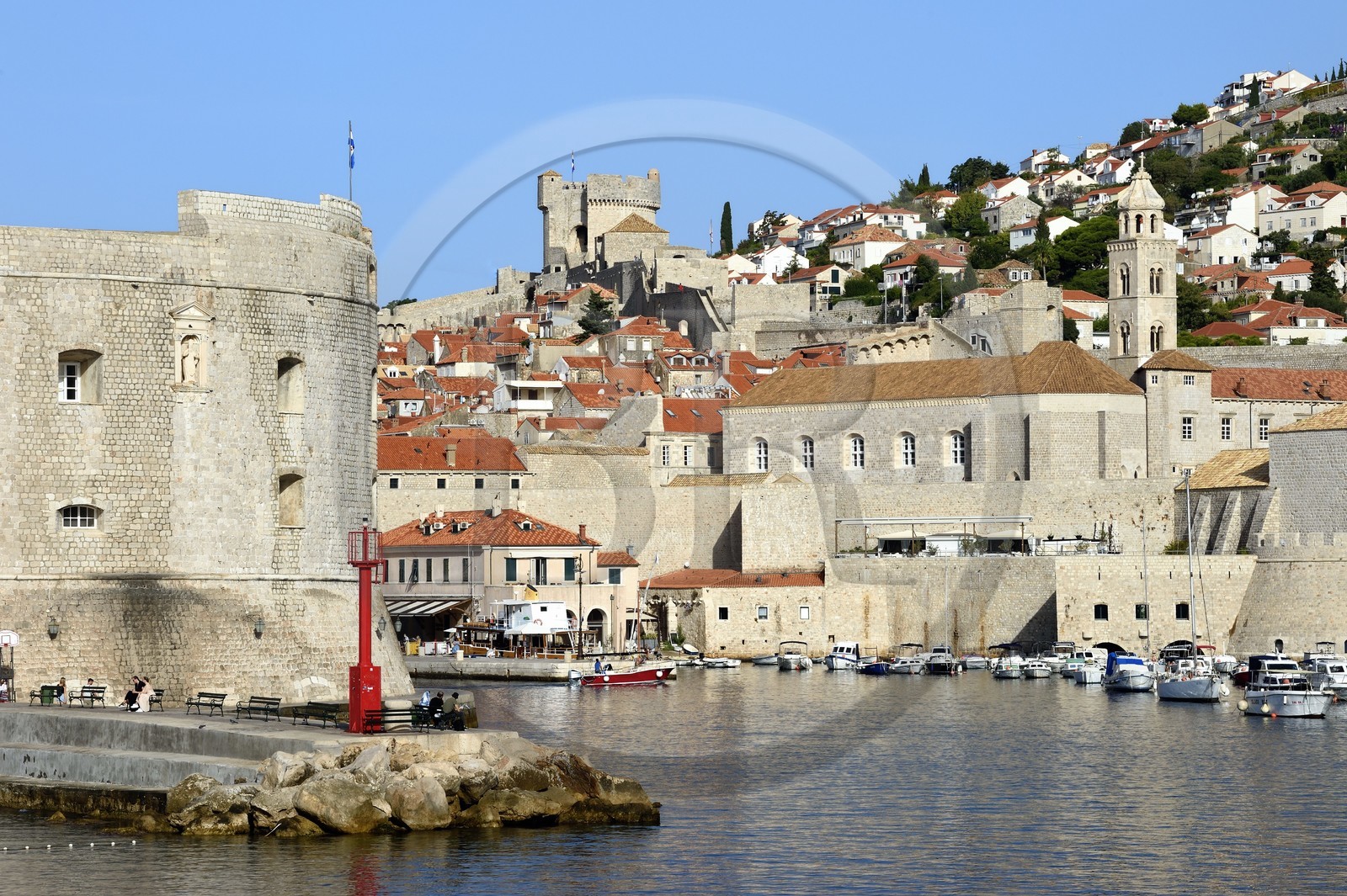 Croatia, Dalmatia, Dalmatian coast, Dubrovnik, Historic Centre listed as World Heritage by UNESCO, the ramparts on the sea side, the Saint Jean Tower building at the entrance to the Port left and the Minceta Tower in the background