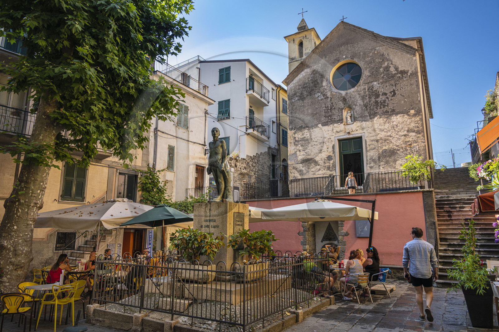 Italy, Liguria, Cinque Terre National Park listed as World Heritage by UNESCO, village of Corniglia, the oratory of the Disciplinati di Santa Caterina and the war memorial in the main square Largo Taragio