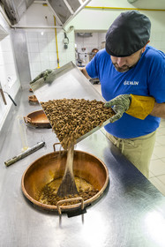 France, Vaucluse, Saint Didier, In the Nougats Silvain workshop,  nougat makers peasant, Charles-Henri Bagnol makes a slab of black nougat, mixture of toasted almonds and the caramelized honey base