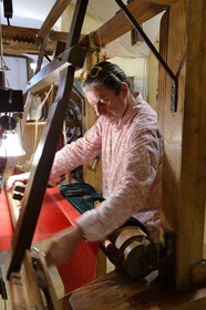 France, Rhone, Lyon, historical site listed as World Heritage by UNESCO, Vieux Lyon (Old Town), Saint George district, Ludovic de la Calle working on a Jacquard loom at the silk trade (Soierie) Saint-Georges
