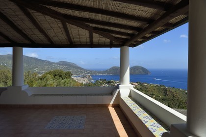 Italy, Sicily, Aeolian Islands, listed as World Heritage by UNESCO, Lipari Island, traditional house on the south-east coast, the citadel of Lipari in the background
