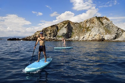 France, Var, Six Fours les Plages, Ile des Embiez, Pointe du Coucoussa, Freestyle windsurfing champion Adrien Bosson on a paddle boarding excursion