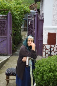 Romania, Transylvania, Valea Viilor (in German Wurmloch), old woman outside her home