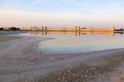 France, Gard, town of Aigues-Mortes, the walls of the city behind the pond