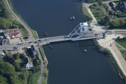 France, Calvados, Pont de Benouville or Pegasus Bridge, drawbridge crossing canal de Caen to the sea, released on June 6, 1944 by a British commando arrived from airspeed horsa gliders at night, entered in the inventory of historical monuments, left the Cafe Gondree first house liberated in France (aerial view)