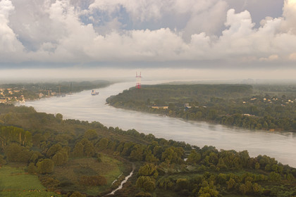 France, Loire Atlantique, Le Pellerin, cargo ship going down the Loire river towards the estuary (aerial view)