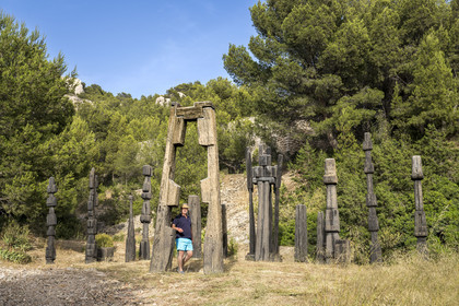 France, Bouches du Rhone, Marseille, Goudes district, La Friche de l'Escalette in the ruins of an old lead processing plant, the collector and creator of the place Eric Touchaleaume in front of the Summer in the Forest (1964-1966) by artist François Stahly