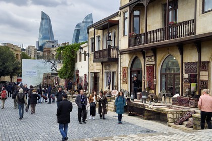 Azerbaijan, Baku, Old City, listed as World heritage by UNESCO, the Asef Zeynalli shopping street and the Flame Towers in the background