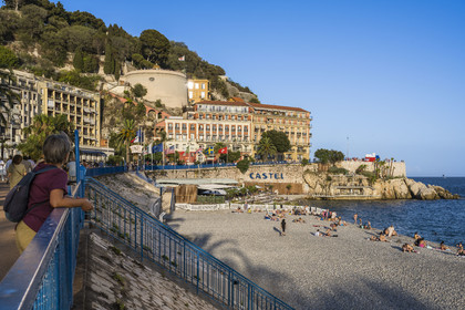 France, Alpes-Maritimes, Nice, listed as World Heritage by UNESCO, Castel beach on the Quai des Etats-Unis and the belvedere on the Castle hill in the background