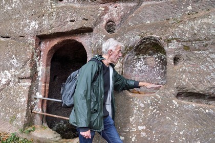 France, Bas Rhin, Northern Vosges Regional Natural Park, Niedersteinbach, Steinbach national forest, Wasigenstein Castle ruins, Mathias Heissler, heritage architect at the county council of Bas-Rhin, shows on the wall pipes that are cut to collect water and bring it to a cistern