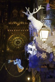 France, Bas Rhin, Strasbourg, old town listed as World Heritage by UNESCO, rosace of the western facade of Notre Dame Cathedral and rue Merciere with its Christmas decorations