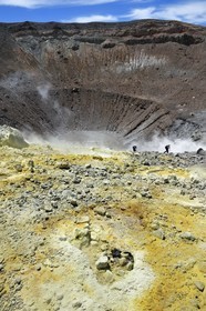 Italy, Sicily, Aeolian Islands, listed as World Heritage by UNESCO, Vulcano Island, hikers in the crater of volcano della Fossa and sulfur fumaroles