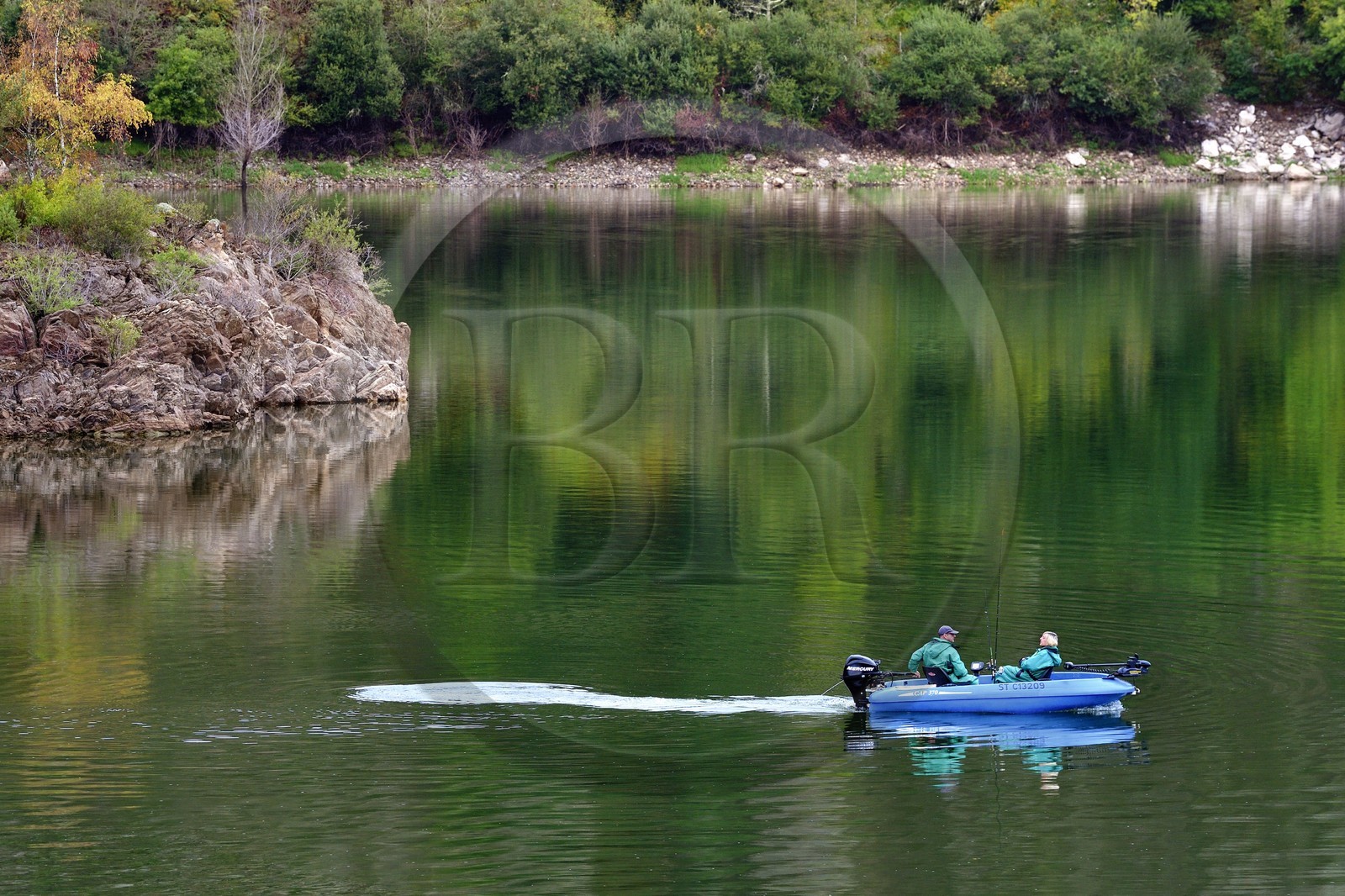 France, Cantal, Gorges de la Truyere (Truyere river canyon), anglers on the reservoir of the Grandval dam