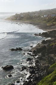 France, Reunion island (French overseas department), Petite-Ile on the southern coast, Grand-Bois beach and rocks, the chimney of the old sugar factory in the background