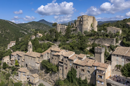 France, Drome, regional natural park of Baronnies provencales, Montbrun les Bains, labeled the Most Beautiful Villages of France, the village and the Renaissance castle of Dupuy-Montbrun (aerial view)