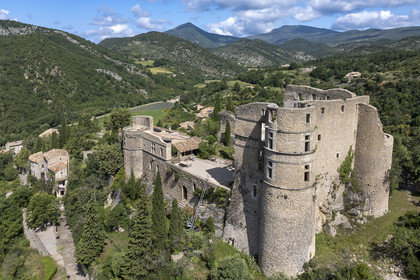 France, Drome, regional natural park of Baronnies provencales, Montbrun les Bains, labeled the Most Beautiful Villages of France, the village and the Renaissance castle of Dupuy-Montbrun (aerial view)