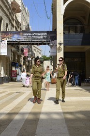 Israel, Jerusalem, Mamilla mall and luxury pedestrian shopping street in the modern city, military women while shopping