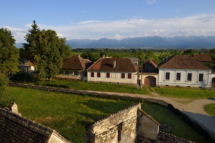 Romania, Transylvania, Cincsor village and the Fagaras Mountains in the Southern Carpathians in the background