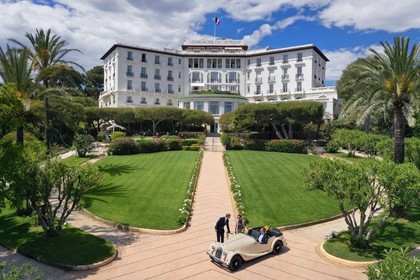 France, Alpes Maritimes, Saint Jean Cap Ferrat, Grand-Hotel du Cap Ferrat, a 5 star palace from Four Seasons Hotel, the doorman welcomes customers in a Morgan Roadster 4 4 (aerial view)