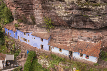 France, Bas Rhin, Parc regional des Vosges du nord (Northern Vosges Regional Natural Park), Eschbourg, Maisons des Rochers (Rocks houses) of Graufthal, semi-troglodytic houses of the 18th century and inhabited until 1958 (aerial view)