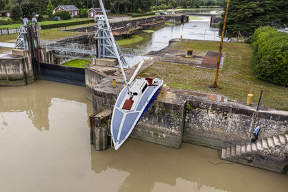 France, Loire Atlantique, Le Pellerin, open-air contemporary art collection Estuary, the 9 m long sailboat sculpture Misconceivable created by the Austrian artist Erwin Wurm at the access lock to the Martinière canal on the Loire river (aerial view)