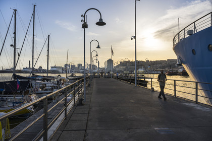 Italy, Liguria, Genoa, the exit of Porto Antico (Old Port) and the Lanterna lighthouse which dominates the commercial port in the background