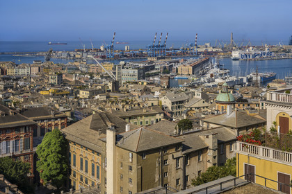 Italy, Liguria, Genoa, Rolli Palace listed as World Heritage by UNESCO in the Strada Nuova today via Garibaldi in the foreground, the Porto Antico (Old Port) and the commercial port overlooked by the lighthouse of La Lanterna in the background, seen from the Belvedere of Castelletto