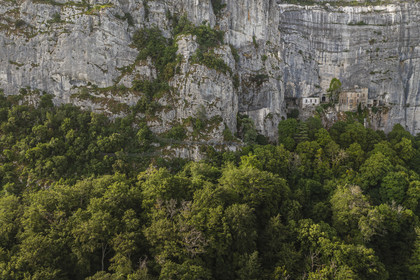 France, Var, Plan d'Aups Sainte Baume, Sainte-Baume Regional Nature Park, Sainte Baume massif, the cave sanctuary of Sainte Marie-Madeleine (St. Mary Magdalene) on the side of the 300m cliff (aerial view)
