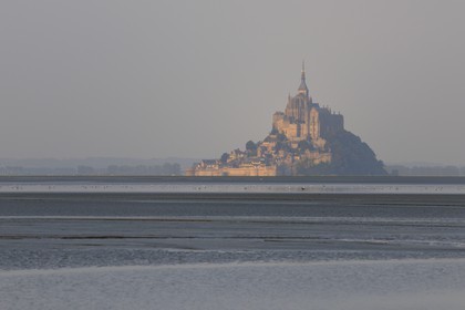 France, Manche, the Mont Saint Michel at dawn seen from the Bay, listed as World Heritage by UNESCO