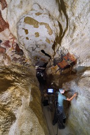France, Dordogne, Montignac, Montignac-Lascaux Parietal Art international Centre (Lascaux 4) building site, the axial diverticulum of the reconstituted cave by the Atelier des Fac-Similés du Périgord (Perigord's Facsimile Workshop AFSP), finishing of the lower part murals by the painter Gilles Lafleur