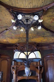 France, Meurthe-et-Moselle, Nancy, Ecole de Nancy Museum, the Art Nouveau dining room of Masson (1903-1906), furniture and woodwork by Eugène Vallin, leather panels and ceiling by Victor Prouvé, the chandelier