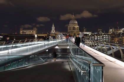 United Kingdom, London, the Millennium Bridge by architect Norman Foster on the Thames river and St. Paul's Cathedral in the background