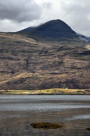 United Kingdom, Scotland, Highland, Inner Hebrides, Isle of Mull, traditional house on the edge of Loch Scridain