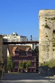 France, Calvados, Caen, the ducal castle of William the Conqueror, porte Saint-Pierre and the half-timbered house of Quatrans dating from 1460 rue de la Geole in the background