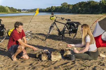 France, Maine-et-Loire, Loire valley listed as World Heritage by UNESCO, Saumur towards Saint-Hilaire, cycling along the banks of the Loire, camping for the night on one of the sandbanks forming islands on the Loire, roasting marshmallows