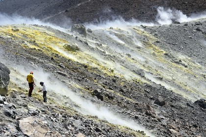 Italy, Sicily, Aeolian Islands, listed as World Heritage by UNESCO, Vulcano Island, crater of volcano della Fossa sulfur fumaroles, volcanologist taking temperature measurements