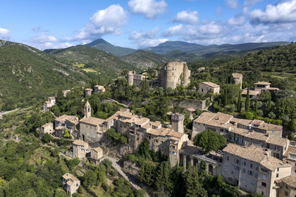 France, Drome, regional natural park of Baronnies provencales, Montbrun les Bains, labeled the Most Beautiful Villages of France, the village and the Renaissance castle of Dupuy-Montbrun (aerial view)