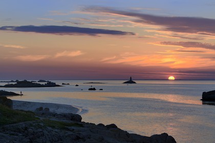 France, Finistere, La Foret Fouesnant, Glenan islands, St Nicolas Island, sunset on the west coast and the former Huic lighthouse now abandoned