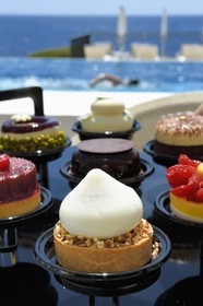 France, Alpes Maritimes, Saint Jean Cap Ferrat, Grand-Hotel du Cap Ferrat, a 5 star palace from Four Seasons Hotel, the chic poolside Club Dauphin, lemon and hazelnut tartlet served with a farandole of desserts