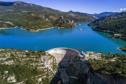 France, Alpes de Haute Provence, the lake of Castillon dam which retains the waters of the Verdon river, giant sundial on the 100 meters high wall (aerial view)