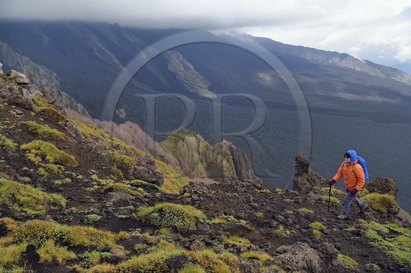 Italy, Sicily, Etna Regional Nature Park, Mount Etna, listed as World Heritage by UNESCO, hikers on the edge of the Valle del Bove which corresponds at a collapse of one of the walls of Mount Etna creating a field of volcanic rocks of 7 km by 6 km