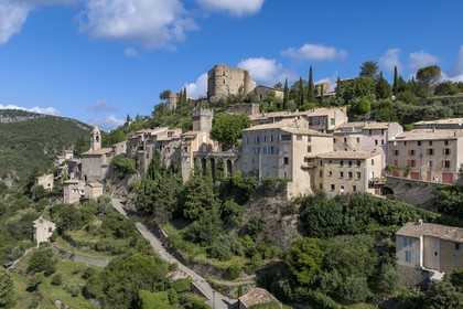 France, Drome, regional natural park of Baronnies provencales, Montbrun les Bains, labeled the Most Beautiful Villages of France, the village and the Renaissance castle of Dupuy-Montbrun (aerial view)