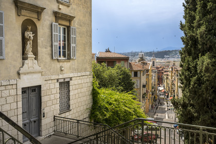 France, Alpes-Maritimes, Nice, listed as World Heritage by UNESCO, Old Nice, stairs leading to the hill of the Chateau, Rue Rossetti and the bell tower of the Sainte Reparate Cathedral in the background
