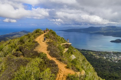 France, Mayotte island (French overseas department), Grande-Terre, Southern Crete Forest Reserve (Reserve Forestiere des Cretes du Sud), hikers at the summit of Mount Choungui (594 meters) and the Bay of Bouéni in the background (aerial view)